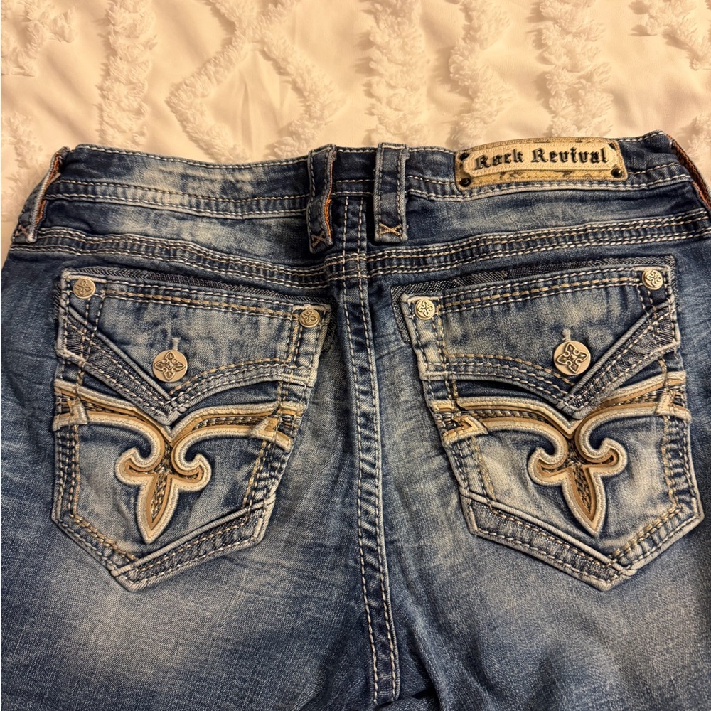 Rock Revival Women's Blue Jeans with Embellished Pockets worn just few times.